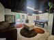 Finished basement features a ping pong table, couch and french doors to the backyard at 3650 Bay Leaf Dr, Loganville, GA 30052