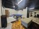 Finished basement with ping pong table, rug and exposed ceiling features at 3650 Bay Leaf Dr, Loganville, GA 30052
