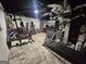 Basement area equipped with exercise equipment and visible utilities above at 3650 Bay Leaf Dr, Loganville, GA 30052