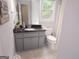 Bathroom features a granite countertop, oval sink and a neutral color scheme, perfect for a modern aesthetic at 3650 Bay Leaf Dr, Loganville, GA 30052