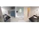 Bright bathroom featuring double vanities, a jacuzzi tub, and an oval window at 3650 Bay Leaf Dr, Loganville, GA 30052