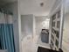 Bathroom with marble flooring, tub, sliding door access to closet and vanity at 3650 Bay Leaf Dr, Loganville, GA 30052