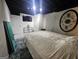 Bedroom features tile flooring, decorative wall hanging, and a large bed at 3650 Bay Leaf Dr, Loganville, GA 30052