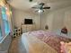 Bedroom featuring a ceiling fan, dresser, and carpeted flooring at 3650 Bay Leaf Dr, Loganville, GA 30052