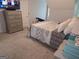 Cozy bedroom with soft carpet, neutral walls, and a large television at 3650 Bay Leaf Dr, Loganville, GA 30052