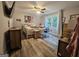 Bedroom featuring wood-look floors, natural light, and a dedicated desk area at 3650 Bay Leaf Dr, Loganville, GA 30052