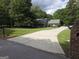 Well-maintained home with a long driveway, lush lawn and mature trees at 3650 Bay Leaf Dr, Loganville, GA 30052