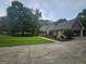 Well-kept home featuring lush green lawn and a convenient driveway at 3650 Bay Leaf Dr, Loganville, GA 30052