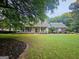 Charming home featuring a landscaped yard, a porch with rocking chairs, and curb appeal at 3650 Bay Leaf Dr, Loganville, GA 30052