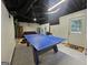 Spacious game room with a ping pong table and access to the backyard at 3650 Bay Leaf Dr, Loganville, GA 30052