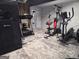 Basement gym equipped with a treadmill, weight machine, and multiple fitness accessories at 3650 Bay Leaf Dr, Loganville, GA 30052