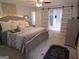 Spacious main bedroom featuring a ceiling fan, an ensuite bathroom and large windows at 3650 Bay Leaf Dr, Loganville, GA 30052