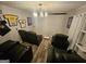 Entertainment room with theater seating, contemporary chandelier, and decor at 3650 Bay Leaf Dr, Loganville, GA 30052