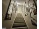 Stairway with mirror accent wall leading to an upper floor at 3650 Bay Leaf Dr, Loganville, GA 30052