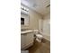 Bathroom with granite top vanity, toilet, and shower-tub combo with dark tile floors at 4194 Wesley Hall Ln, Decatur, GA 30035