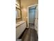 Bathroom featuring vanity with granite countertop and open access to large walk-in closet at 4194 Wesley Hall Ln, Decatur, GA 30035