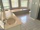 Bathroom featuring a tub, tiled floor and double sink vanity at 100 Parliament Ct, Fayetteville, GA 30215