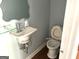 Powder room featuring a modern vessel sink and compact toilet at 100 Parliament Ct, Fayetteville, GA 30215