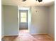 Bedroom featuring wood subfloor, a window, and doorway at 100 Parliament Ct, Fayetteville, GA 30215