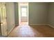 Bright bedroom with wood subfloor and window at 100 Parliament Ct, Fayetteville, GA 30215
