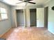 Bedroom featuring two closets and doorway at 100 Parliament Ct, Fayetteville, GA 30215