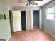 Bedroom featuring natural light from a window and open closets at 100 Parliament Ct, Fayetteville, GA 30215