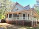 Charming home with a wraparound porch and great craftsman style windows at 100 Parliament Ct, Fayetteville, GA 30215