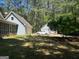 Residential homes with garages and a private lawn at 100 Parliament Ct, Fayetteville, GA 30215