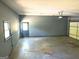 Spacious garage featuring an automatic door opener, access door, and a window for natural light at 100 Parliament Ct, Fayetteville, GA 30215