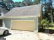 Side view of a one-car detached garage at 100 Parliament Ct, Fayetteville, GA 30215
