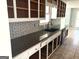 Kitchen featuring stainless steel appliances, tiled backsplash, modern countertops, and unfilled cabinets at 100 Parliament Ct, Fayetteville, GA 30215