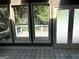 Sunroom with tiled floor, windows, and door leading to the back deck at 100 Parliament Ct, Fayetteville, GA 30215