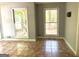 Bright sunroom with windows offering views of the backyard at 100 Parliament Ct, Fayetteville, GA 30215