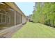 Manicured backyard and screened in porch at 1619 Cascade Overlook, Peachtree City, GA 30269