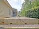 A nice paver patio extends to a wooden retaining wall in the backyard at 1619 Cascade Overlook, Peachtree City, GA 30269