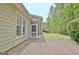 Brick patio next to screened in porch and well manicured lawn at 1619 Cascade Overlook, Peachtree City, GA 30269