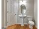 Half bathroom featuring a pedestal sink and classic design, perfect for guests at 1619 Cascade Overlook, Peachtree City, GA 30269