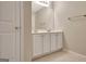 Bathroom featuring double sink vanity, and framed mirror at 1619 Cascade Overlook, Peachtree City, GA 30269