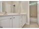 Bathroom features double sink vanity, white cabinetry, and access to the toilet and shower at 1619 Cascade Overlook, Peachtree City, GA 30269