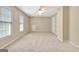 Spacious bedroom with neutral walls, carpeted floor, window, and ceiling fan at 1619 Cascade Overlook, Peachtree City, GA 30269