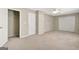 Bright bedroom features neutral walls, carpeted floor, ceiling fan, and double door closet at 1619 Cascade Overlook, Peachtree City, GA 30269