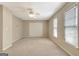Large bedroom features a ceiling fan, carpet, and double closet at 1619 Cascade Overlook, Peachtree City, GA 30269