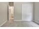 View of the bedroom with neutral carpeting and access to the ensuite bathroom and closet at 1619 Cascade Overlook, Peachtree City, GA 30269