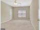 Spacious bedroom with neutral walls, carpet, and a ceiling fan at 1619 Cascade Overlook, Peachtree City, GA 30269