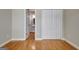 Bedroom featuring hardwood floors, neutral paint, and a door that leads to a bathroom at 1619 Cascade Overlook, Peachtree City, GA 30269