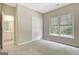 Bright bedroom with neutral walls, window and access to the ensuite bathroom at 1619 Cascade Overlook, Peachtree City, GA 30269