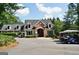 Clubhouse surrounded by lush greenery and ample parking at 1619 Cascade Overlook, Peachtree City, GA 30269