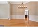 Elegant dining room featuring a modern light fixture and wainscoting detail for a sophisticated touch at 1619 Cascade Overlook, Peachtree City, GA 30269
