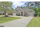 Charming brick two-story home with well-manicured lawn and long driveway at 1619 Cascade Overlook, Peachtree City, GA 30269