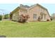 Brick home exterior with spacious backyard and mature landscaping at 1619 Cascade Overlook, Peachtree City, GA 30269